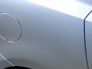 Paint scratch on right rear quarter panel